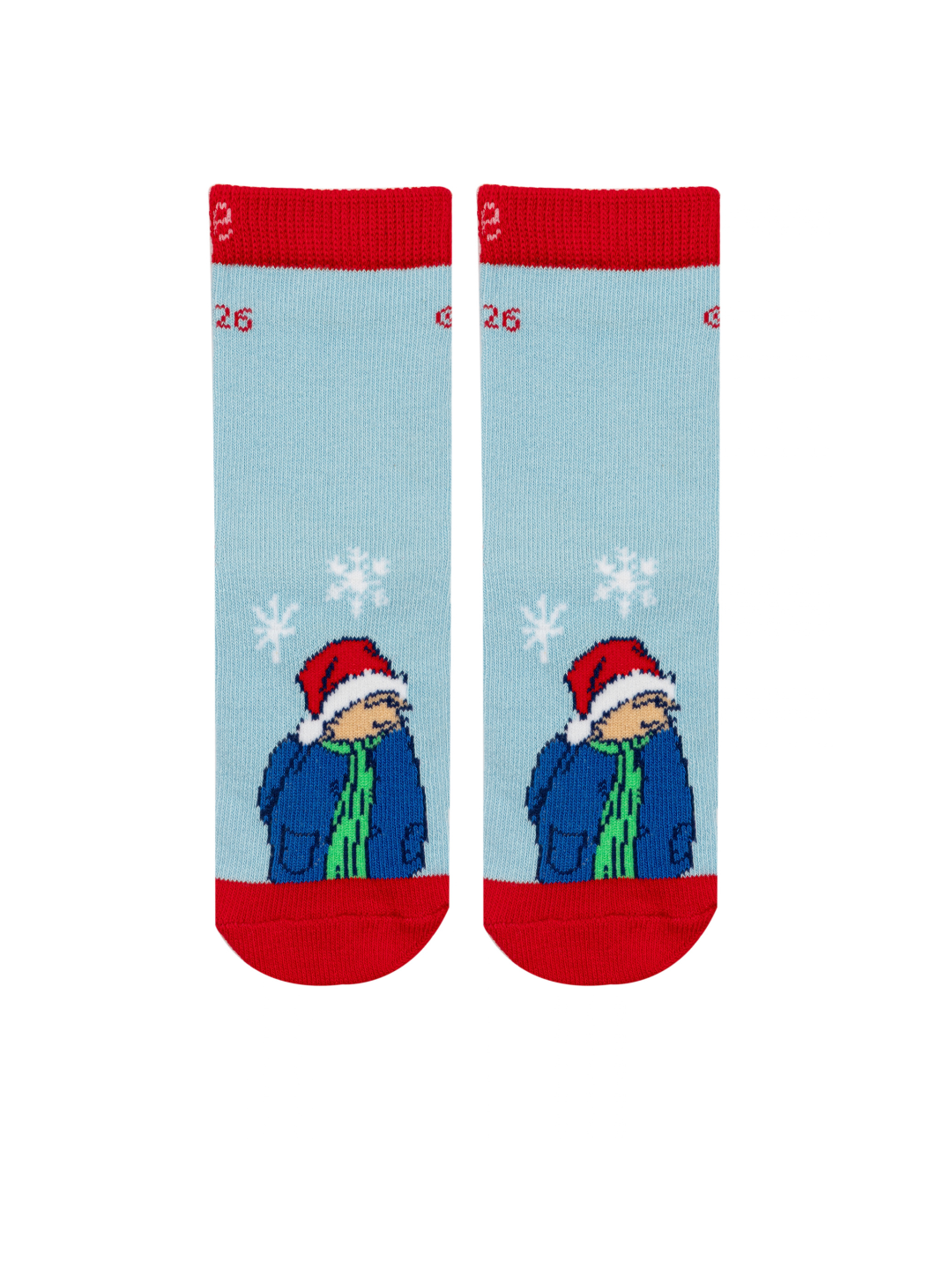 Paddington™ Christmas Socks in pale blue, with Paddington in his duffle coat and a Santa hat among falling snowflakes