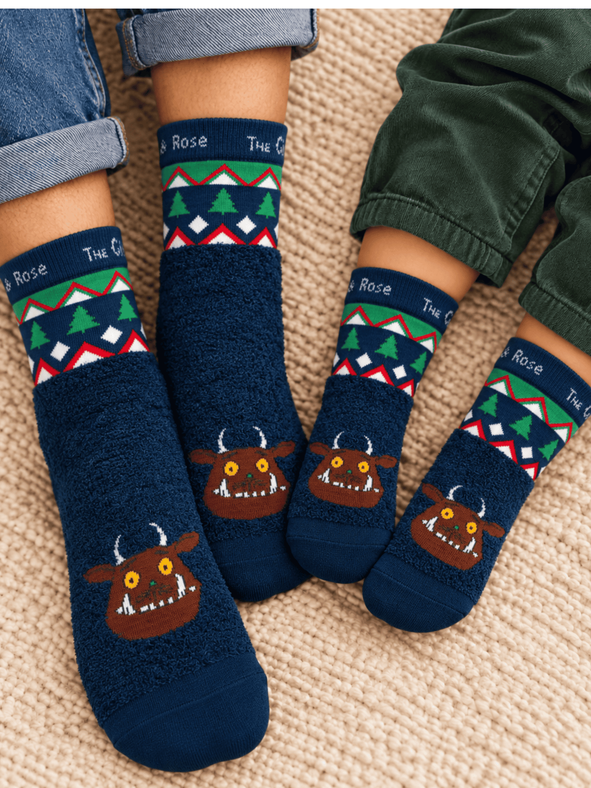Gruffalo™ Christmas Socks worn by an adult and a child together, navy fluff with a Fair Isle Christmas cuff