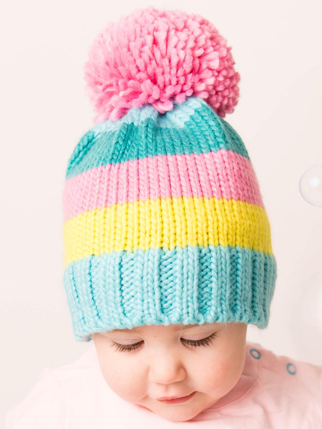 Pastel-Striped Bobble Hat